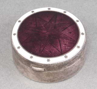 A circular silver and enamelled box with hinged lid Birmingham 1910, 4cm, by S Blanckensee & Sons Ltd.  32g  