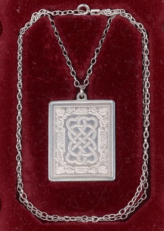 John Pinches, an engraved silver Valentines pendant and chain, marked silver 925/1000, Valentines Day 1977, hung on a 925 silver chain, 35g, boxed and with certificate 