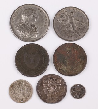 A collection of medallions and tokens to include an 1800 George III preserved from assignation medallion, a 1909 Grand National Jubilee medallion, 2 Worcester City County one penny tokens 1811, a silver Bristol 12 pence token (drilled) and a 1935 Silver Jubilee medal 