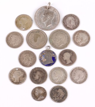 A collection of mainly George V and VI silver threepences, a George VI shilling and a Queen Anne 1704 silver two pence  