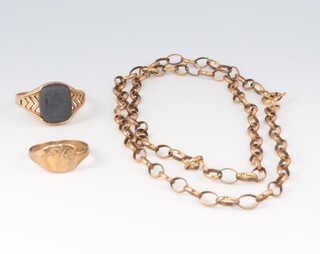 A gentleman's 9ct gold signet ring set carved hardstone, size V, a 9ct gold signet ring monogrammed size J 1/2 (both misshapen) and a gilt metal belcher link chain with 9ct gold clasp  