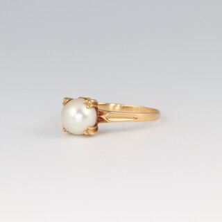 A gold testing as 14ct ring set a pearl, size K, 1.9g 