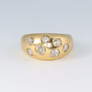 An 18ct gold ring set 7 diamonds, size N, 12g
