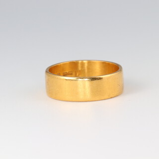 A 22ct gold wide wedding band, size N 1/2, 6.1g 