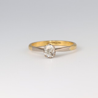 A gold marked 18ct solitaire diamond ring, size N 1/2, 2.5g 