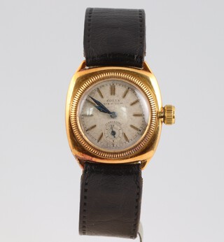A gentleman's Rolex Oyster wristwatch, circa 1927, the dial signed Rolex Oyster Ultra Prima, with silver dial and gilt batons, the movement marked Rolex X6 positions hair spring, 15 rubies, Swiss Made, contained in an 18ct gold case, the dust plate marked Rolex 25703