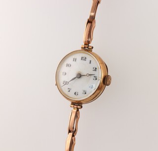 A lady's Vertex wristwatch with enamelled dial, Roman numerals contained in a 9ct gold case with integral bracelet 