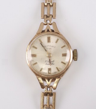 A lady's Rotary wristwatch with white dial and gilt batons, movement marked 17 jewels Swiss, contained in a 9ct gold case together with a gold tie pin 