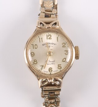 A lady's Rotary wristwatch with silvered dial Arabic numerals, movement marked 17 jewels, contained in a 9ct gold case on a gilt bracelet 