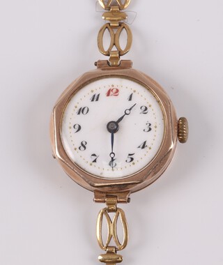 A lady's wristwatch with enamelled dial Arabic numerals, movement Swiss Made 15 jewels, contained in a 9ct gold octagonal case on a gilt bracelet 
