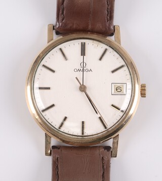 A gentleman's Omega Datejust wristwatch with silvered dial, batons, calendar aperture and sweep second hand, movement marked Omega 17 jewels and numbered 207612 41 1030, contained in a 9ct gold case no. 1325017, the reverse engraved "Presented to Mr E W Stokes in appreciation of his 33 years loyal service with The Eastern Press Ltd. 1979", boxed  