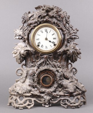 N Muller New York, a striking shelf clock with 12cm paper dial, Roman numerals, contained in a spelter case decorated game trophies, the door to the pendulum marked N Muller NY no.65, patent A.F 1858 