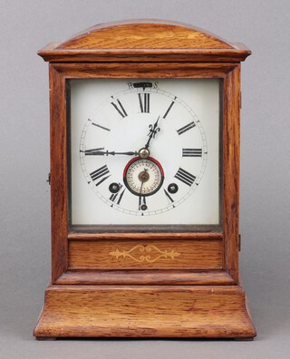 Winterhalder & Hofmeier, an alarm clock with 13cm painted dial, Roman numerals, alarm dial, back plate marked W&H Sch. complete with pendulum and key, contained in an oak case 30cm x 20cm x 15cm 