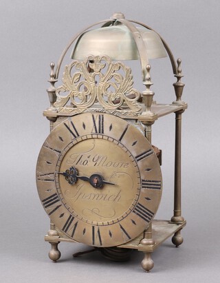 A Victorian copy of a 17th Century lantern wall clock, the 17cm dial marked Thomas Moore Ipswich, complete with pendulum and weight 30cm h x 15cm w x 15cm d  