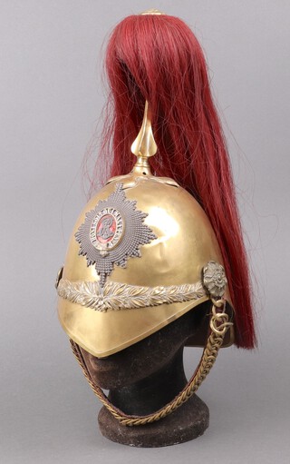 An Edwardian Albert Patent helmet, the enamelled plate with royal cypher and red plume, possibly The 2nd Dragoon Guards 