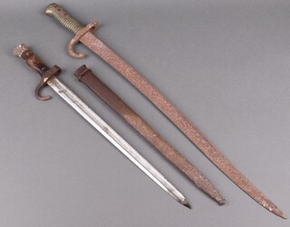 A chassepot bayonet with 40cm blade, dated 1893, complete with scabbard and 1 other chassepot bayonet with 57cm blade 