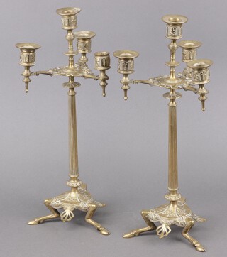 A pair of Victorian gilt metal 5 light candelabrum with detachable sconces, raised on reeded columns with triform base, hoof feet 41cm 
