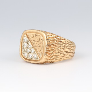 A gentleman's 9ct barked gold and diamond set signet ring, size R 1/2, 15.3g 