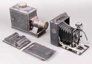 A metal magic lantern 22cm and a folding camera 