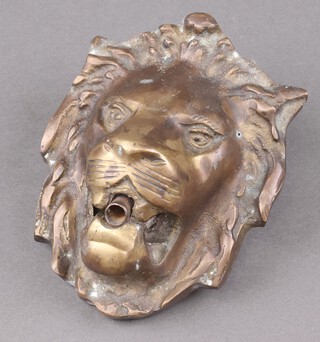 A brass fountain head in the form of a lions mask 15cm  x 11cm 