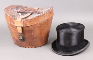 Lock & Co Hatters, a gentleman's black top hat, size 7 1/2, complete with leather carrying case with Royal Hotel Gibraltar label 