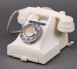 A GPO 300 ivory coloured Bakelite dial telephone with drawer to base and chrome dial, marked 332L PX 55/2A, converted for modern use  