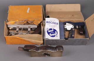 A brass shoulder plane, a Stanley 50 combination plane with blades boxed, a Record 730 fibreboard plane boxed 