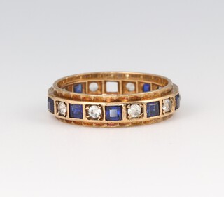 A 9ct gold eternity ring set blue and white stones, (1 stone missing), size K, 2.5g 