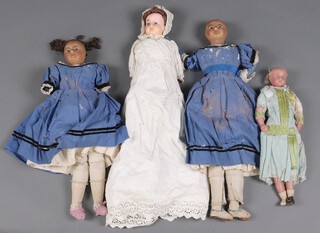A collection of 4 mid 19th Century and later dolls to include a pair of twin wax composition head and shoulder dolls, the bodies of fabric filled with sawdust in contemporary blue dresses, each 56cm l, a wax composition porcelain head and shoulders doll with porcelain arms and porcelain lower legs, sawdust filled body (missing large areas of wax to face) 52cm l and a late Victorian poured wax doll in contemporary outfit 42cm l 