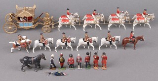 A Britains George VI Coronation coach model with 8 Windsor greys, 5 life guard mounted band, figure of the Queen on Burmese, Royal Marine Ensign (f), 2 Yeoman of The Guard and a small collection of other figures  