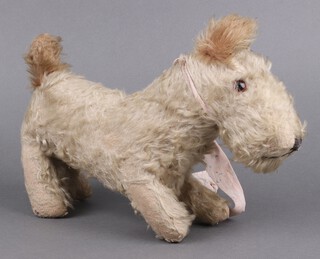 A 1930/40's mohair covered, wood wool filled child's toy in the form of a Scottie Dog 24cm h x 39cm w