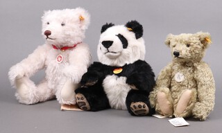 Two Steiff bears to include a black and white mohair panda no.064258 31cm h,  a white mohair bear no.004995 42cm h and a replica "Classic Teddy Bear 1920" in golden wool no.737