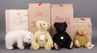 Steiff, a collection of 4 bears to include "British Collectors Teddy Bear 2003" in yellow mohair 36cm,  limited edition 366/4000, boxed and with certificate, a replica 1953 teddy bear in black mohair 35cm, limited edition 898/3000, boxed and with certificate, a "100 Years of Steiff" teddy bear 27cm, limited edition 7321,  boxed and a "Knut Masterpiece" in white mohair 30cm h, limited edition 2981/3000, boxed and with certificate 