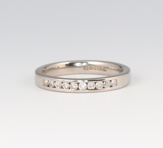 A platinum and diamond set half eternity ring, size N, 3.8g