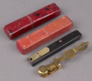 A 19th Century brass sovereign balance cased and a hardwood and mahogany quill cutter cased 