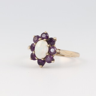 A 9ct gold opal and amethyst set ring, size N, 2.5g  