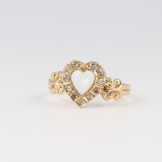 An 18ct gold ring set a heart shaped opal surrounded by diamonds, size K, 2.9g 