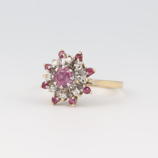 An 18ct gold ruby and diamond cluster ring, size k, 3.3g 