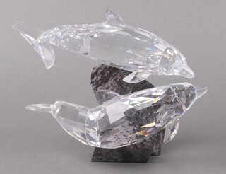 A Swarovski Crystal Ocean Friendship figure of 2 dolphins on a granite base 15cm, boxed