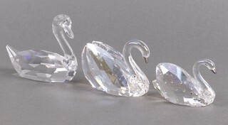A pair of Swarovski Crystal swans 6cm and 7cm and 1 other 5cm, boxed 
