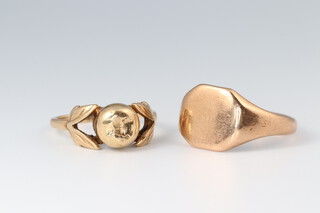 A 9ct gold signet ring size Q and a 9ct gold ring decorated an apple (dented) size L 1/2, gross weight 7g  