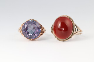 A gold marked 14k ring set an amethyst, size K, 2.4g together with a silver and gold plated ring marked 935 set a cabochon cut garnet size M, 2.6g 