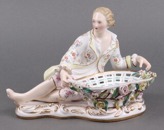 A Meissen style sweetmeat dish in the form of a seated gentleman with floral encrusted basket, the base with stylised crossed sword mark 16cm 