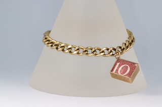 A 9ct gold flat link bracelet with 10 shilling note charm and heart shaped padlock, 19.1g 