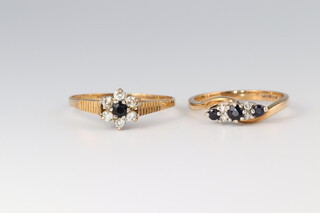 A 9t gold cluster ring set diamonds and blue stones size T and a 9ct gold 3 stone and diamond twist ring size M 1/2, gross weight 3.4g 