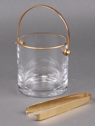 A Baccarat cylindrical glass ice pail with gilt metal swing handle and matching tongs, 12cm h x 13cm diam. 