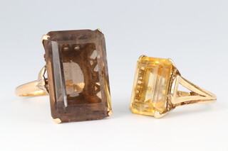 A 9ct gold ring set a rectangular yellow cut stone size M,  together with 1 other set a smoky quartz size W, gross weight 16g 