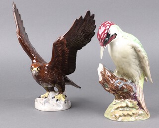A Beswick figure of a Woodpecker 1218 22cm h and 1 other The Golden Eagle 2062 26cm 