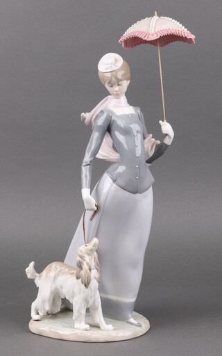 A Lladro figure - Lady with a Shawl walking an Afghan Hound 4914, 42cm 