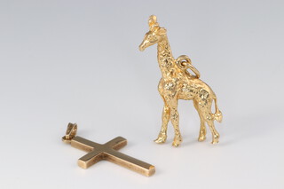 A 9ct gold cross together with a charm in the form of a giraffe 5.5g 
